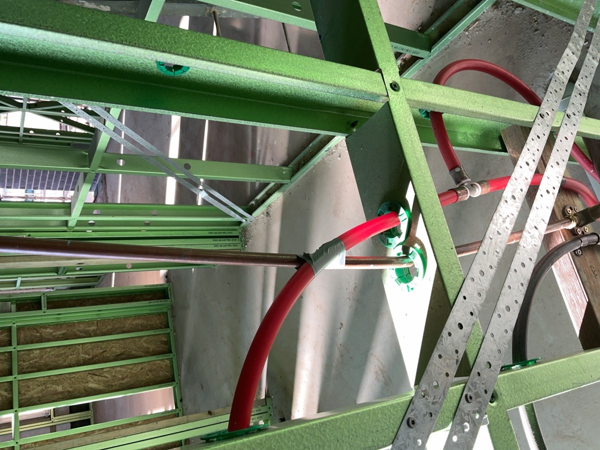 Gas pipes in contact with hot water pipes, recorded during a lock-up inspection in Oran Park